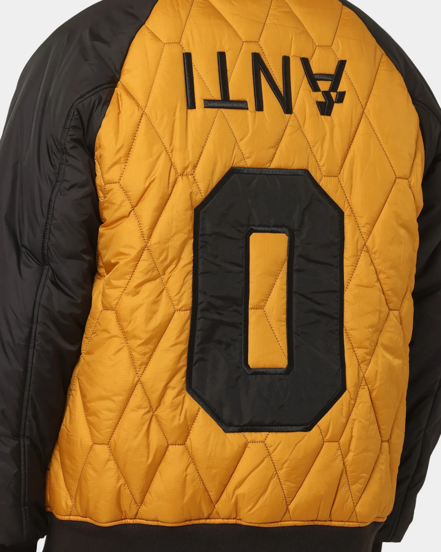 The Anti Order Corvus Quilted Bomber Jacket Mustard/Black/White